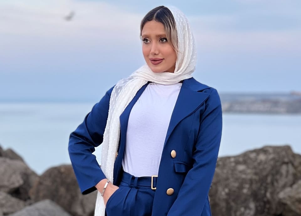 Iran Dress Code- Women with a blue coat